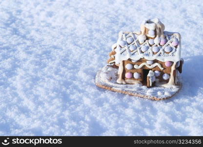 Gingerbread house in snow