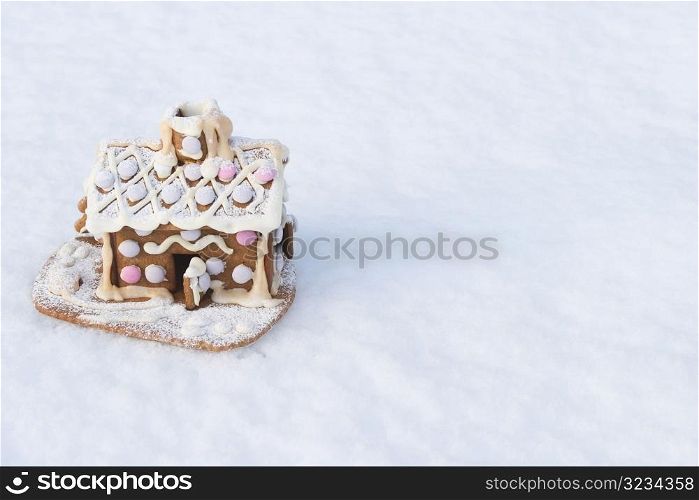 Gingerbread house in snow