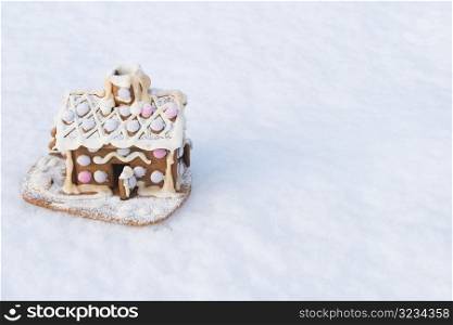 Gingerbread house in snow