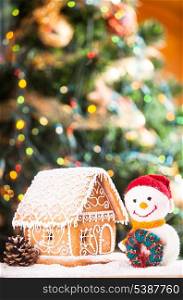 gingerbread house over on the snow and lovely handmade snowman