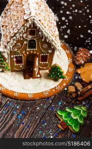 Gingerbread house with lights. Gingerbread house with lights on dark background, xmas theme