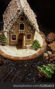 Gingerbread house with lights. Gingerbread house with lights on dark background, xmas theme