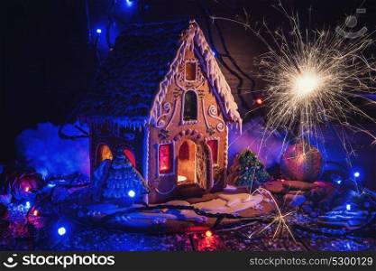 Gingerbread house with lights. Gingerbread house with lights on dark background, xmas theme