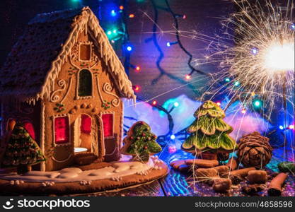 Gingerbread house with lights on dark background, xmas theme