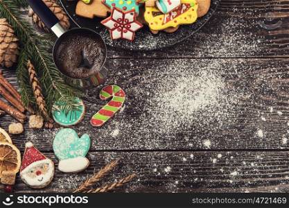 Gingerbreads and coffee for new years and christmas on wooden background, xmas theme. Gingerbreads and coffee for new years or christmas