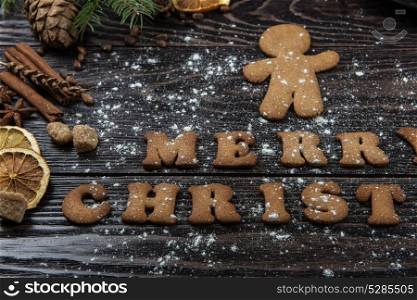 Gingerbreads and coffee for new years or christmas. Gingerbreads and coffee for new years and christmas on wooden background, xmas theme