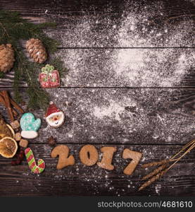 Gingerbreads for new 2017 year on wooden background, xmas theme