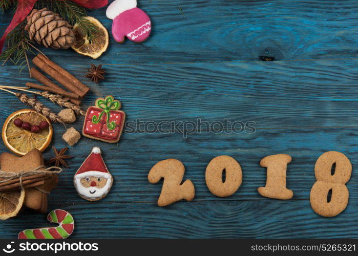 Gingerbreads for new 2017 year on wooden background, xmas theme. Gingerbreads for new 2017 years