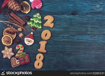 Gingerbreads for new 2017 year on wooden background, xmas theme. Gingerbreads for new 2017 years