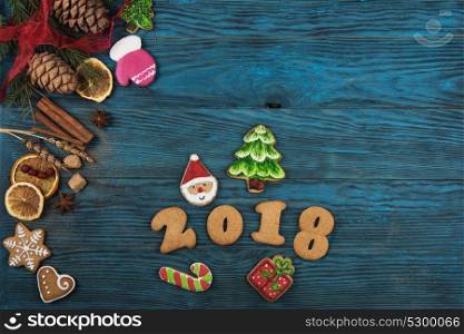 Gingerbreads for new 2017 year on wooden background, xmas theme. Gingerbreads for new 2017 years