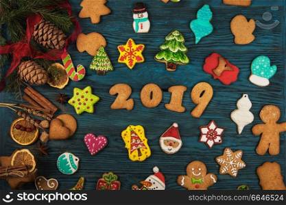 Gingerbreads for new 2019 year holiday on wooden background, xmas theme. Gingerbreads for new 2019 years