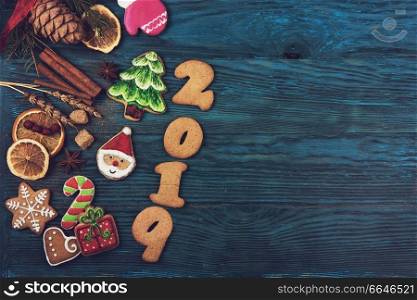 Gingerbreads for new 2019 year on wooden background, xmas theme. Gingerbreads for new 2019 years