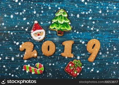 Gingerbreads for new 2019 year on wooden background, xmas theme. Gingerbreads for new 2019 years