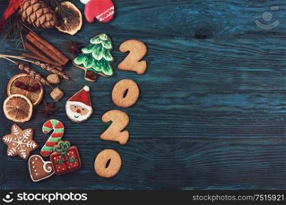 Gingerbreads for new 2020year on wooden background, xmas theme. Gingerbreads for new 2020 years