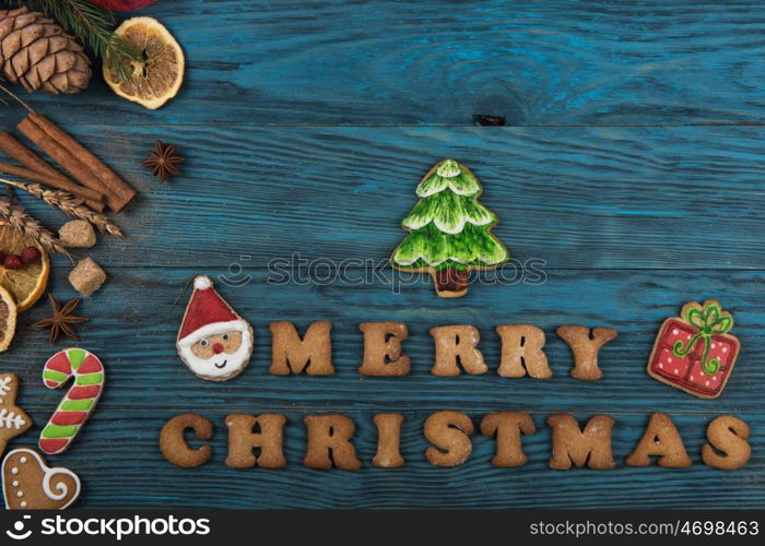 Gingerbreads for new years and christmas. Gingerbreads for christmas on wooden background