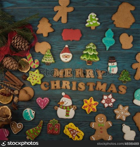 Gingerbreads for new years and christmas. Gingerbreads for christmas on wooden background
