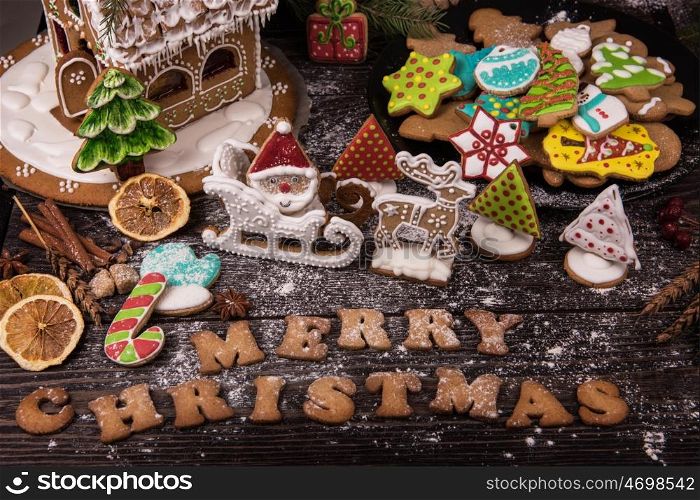 Gingerbreads for new years and christmas. Gingerbreads for christmas on wooden background