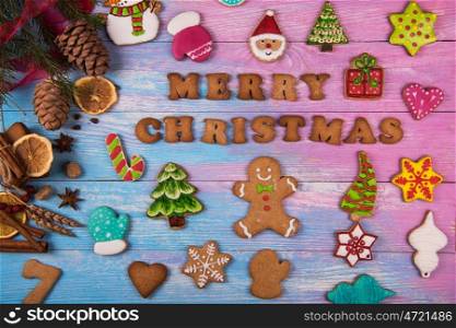 Gingerbreads for new years and christmas. Gingerbreads for new years and christmas on wooden background with space for design