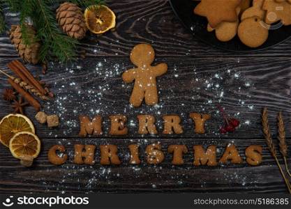 Gingerbreads for new years and christmas. Gingerbreads for new years and christmas on wooden background, xmas theme