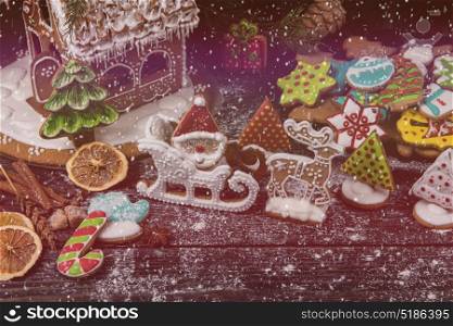 Gingerbreads for new years and christmas. Gingerbreads for new years and christmas on wooden background, xmas theme