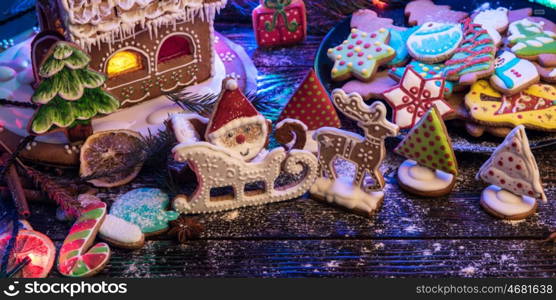 Gingerbreads for new years and christmas on wooden background, xmas theme