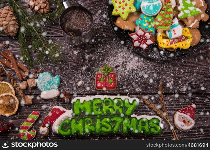 Gingerbreads for new years and christmas on wooden background, xmas theme