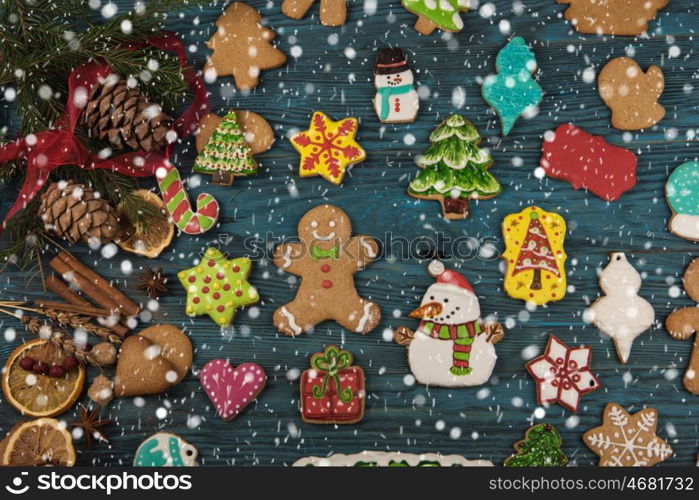 Gingerbreads for new years and christmas on wooden background, xmas theme