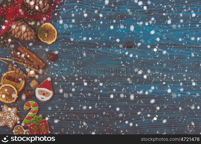 Gingerbreads for new years and christmas on wooden background, xmas theme