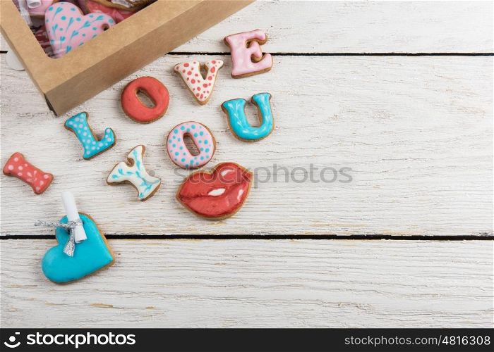 Gingerbreads for Valentines Day. Gingerbreads for Valentines Day in gift box on white wooden background