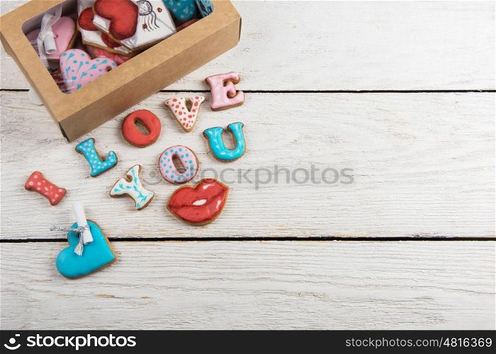 Gingerbreads for Valentines Day. Gingerbreads for Valentines Day in gift box on white wooden background