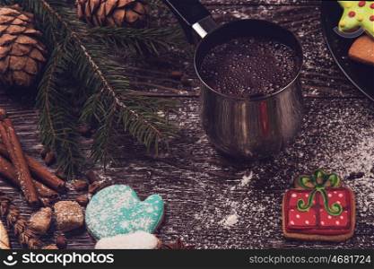 Gingerbreads with coffee for new years and christmas on wooden background, xmas theme