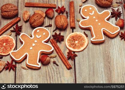 Gingerbreads with spices on the wooden table. Christmas aroma decor. Christmas aroma decor