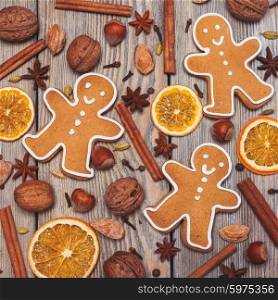 Gingerbreads with spices on the wooden table. Christmas aroma decor. Christmas aroma decor