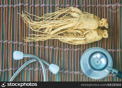 Ginseng and Stethoscope in healthy concept.