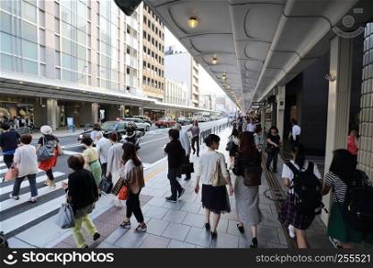 Gion , KYOTO , JAPAN - May 2016: Modern street scene with people on Shijo Dori Street, Gion quarter, Kyoto.