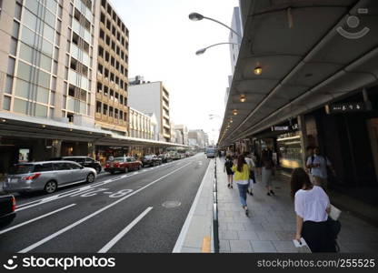 Gion , KYOTO , JAPAN - May 2016: Modern street scene with people on Shijo Dori Street, Gion quarter, Kyoto.