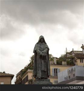 Giordano Bruno statue in Campo de&rsquo; Fiori, Rome, under gray sky, square image