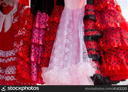 gipsy flamenco dancer costumes in a row pink and red colors with spots
