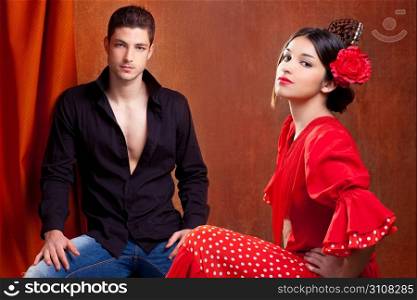 Gipsy flamenco dancer couple from Spain with red rose and spanish back comb peineta