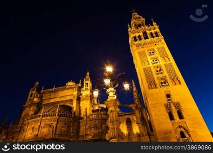 Giralda bell tower by night in Seville - Spain