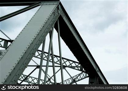 Girder and framing structure on metal bridge.