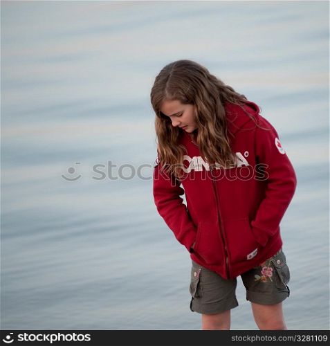 Girl along shoreline in Gimli, Manitoba, Canada