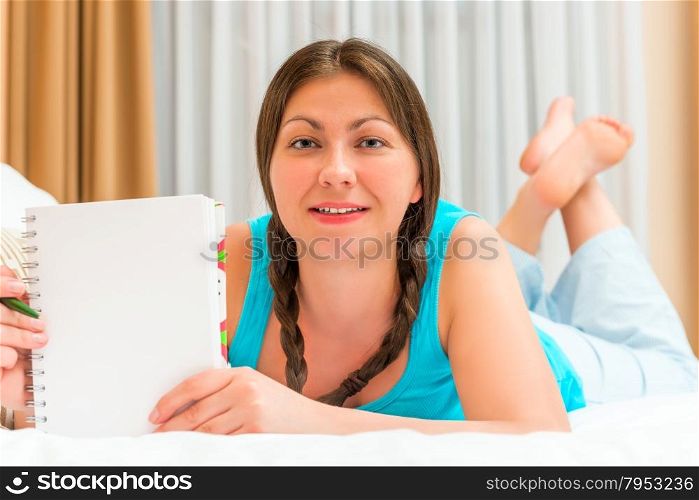 girl and a blank sheet of notebook for writing