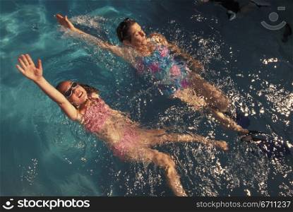 Girl and a woman swimming