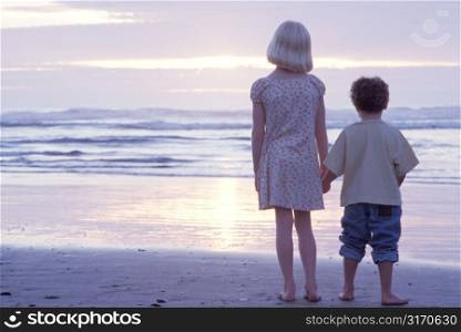 Girl and Boy Looking at Ocean