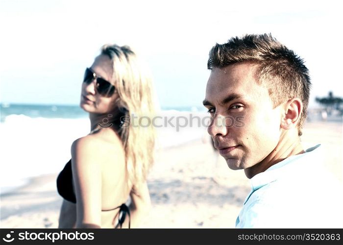 girl and boy on ocean beach