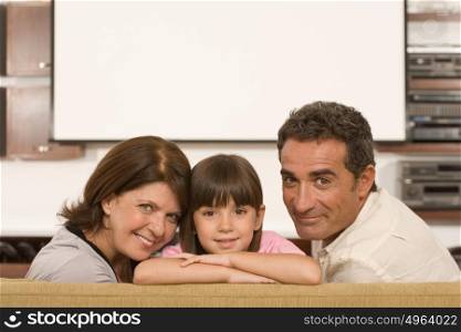Girl and grandparents in living room