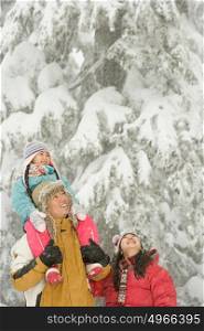 Girl and parents in snow