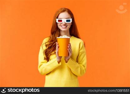 Girl anticipate start of movie, smiling excited, visit cinema, holding popcorn and grinning, wear 3d glasses to watch new fantasy film, like watching premiere in theatre on big screen, orange wall.. Girl anticipate start of movie, smiling excited, visit cinema, holding popcorn and grinning, wear 3d glasses to watch new fantasy film, like watching premiere in theatre on big screen, orange wall