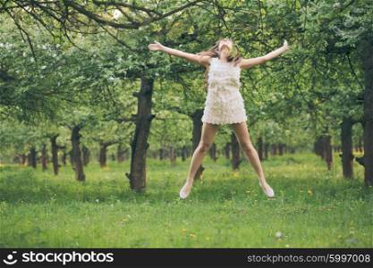Girl are jumping in the park like a star. Girl are jumping in the park